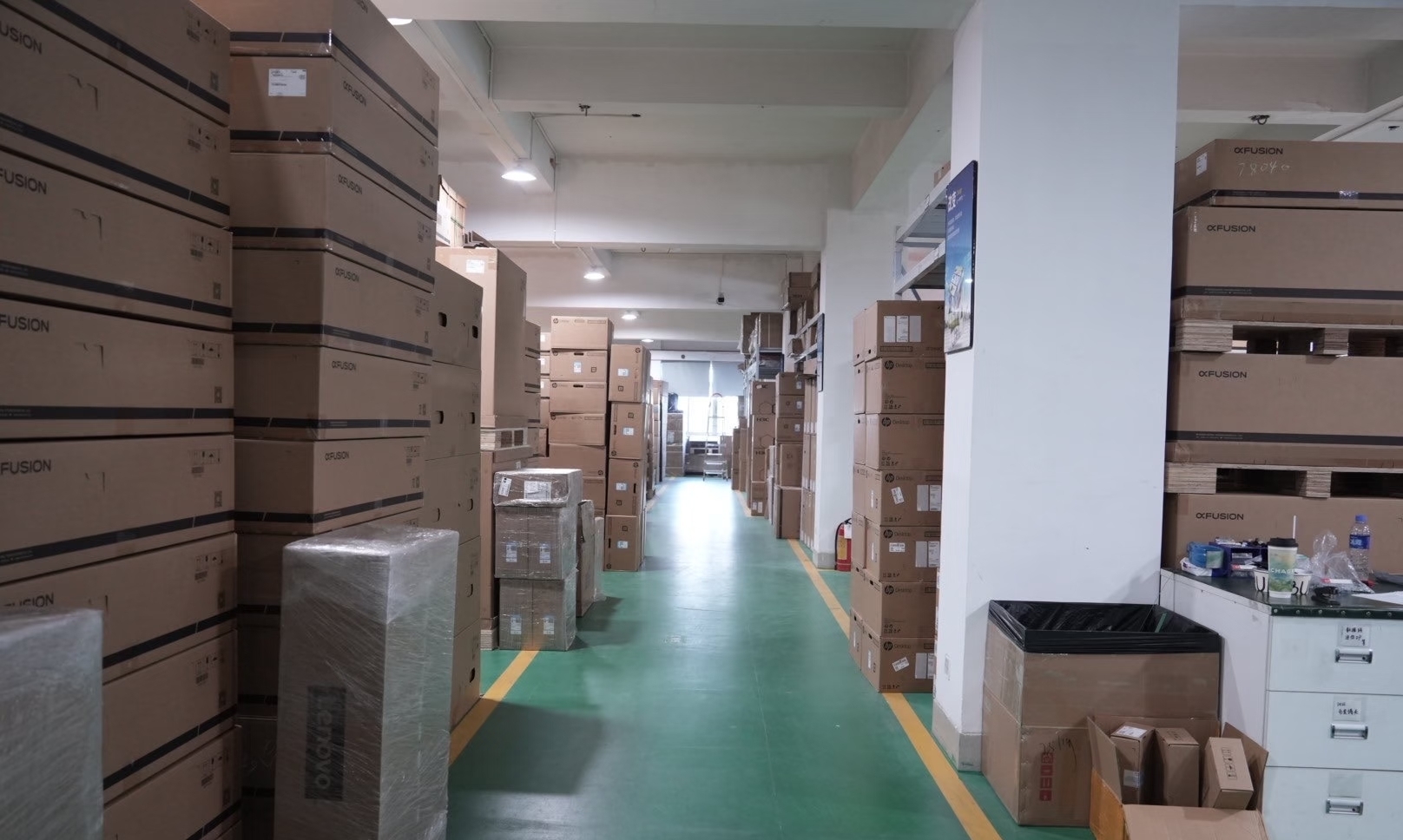 Warehouse aisle with packaged hardware and cartons